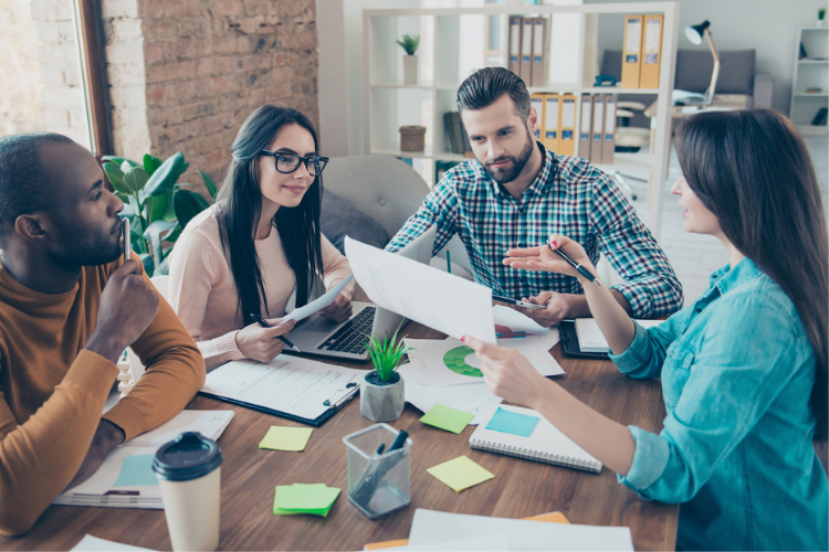 group-of-people-working-together-at-a-table